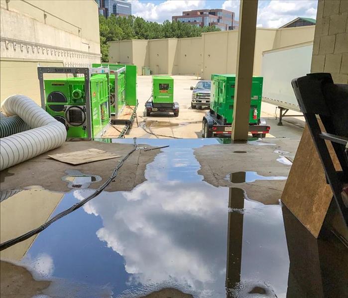 Flood water on the ground of a loading dock of a Nashville business