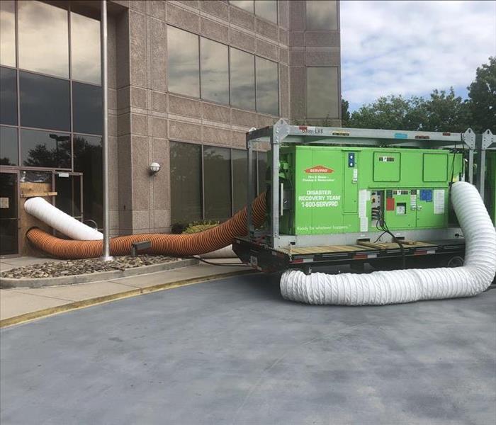 SERVPRO drying equipment setup outside of a commercial loss